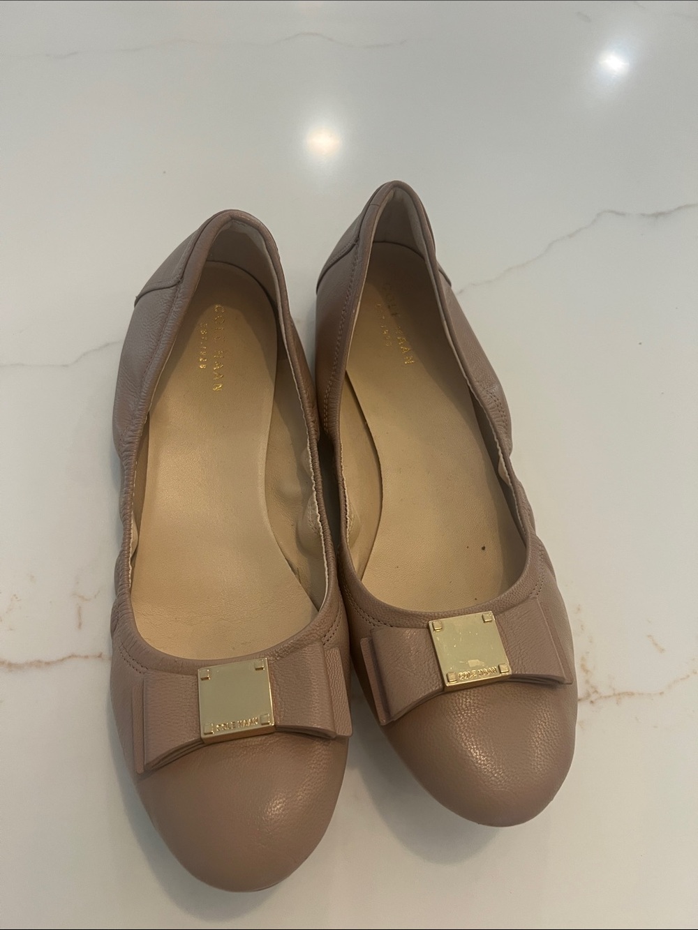 Cole Haan Nude Leather Bow Flats with Gold Plaque